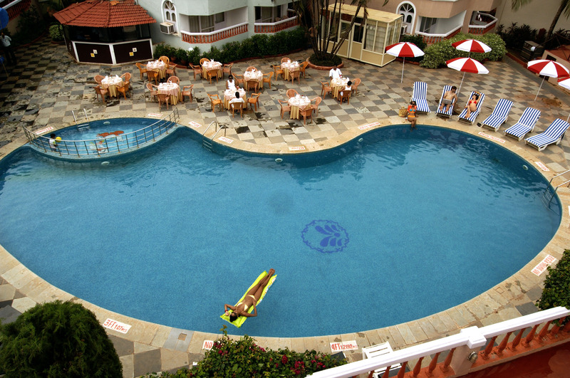 Photo of Whispering Palms Beach Resort, 4-star hotel in Candolim