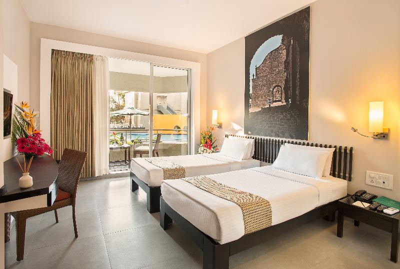 Photo of Whispering Palms Beach Resort, 4-star hotel in Candolim
