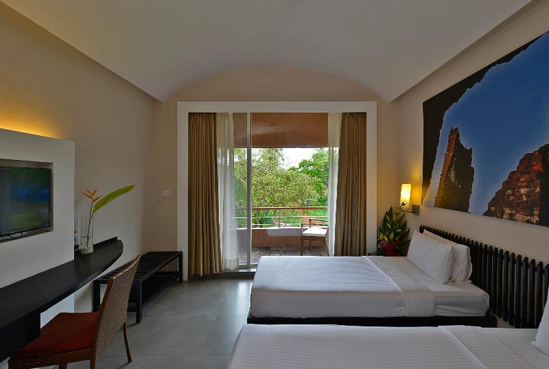 Photo of Whispering Palms Beach Resort, 4-star hotel in Candolim