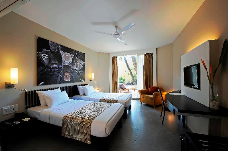 Photo of Whispering Palms Beach Resort, 4-star hotel in Candolim