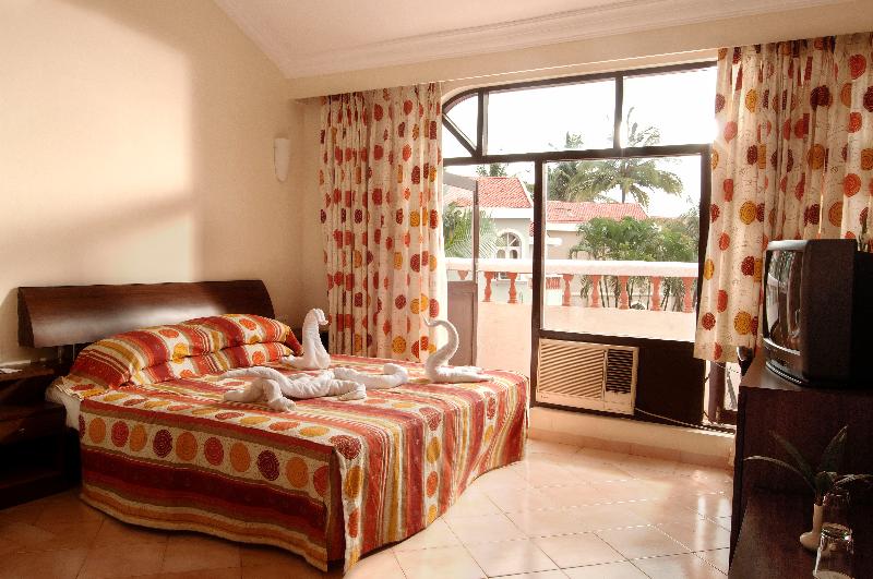 Photo of Whispering Palms Beach Resort, 4-star hotel in Candolim