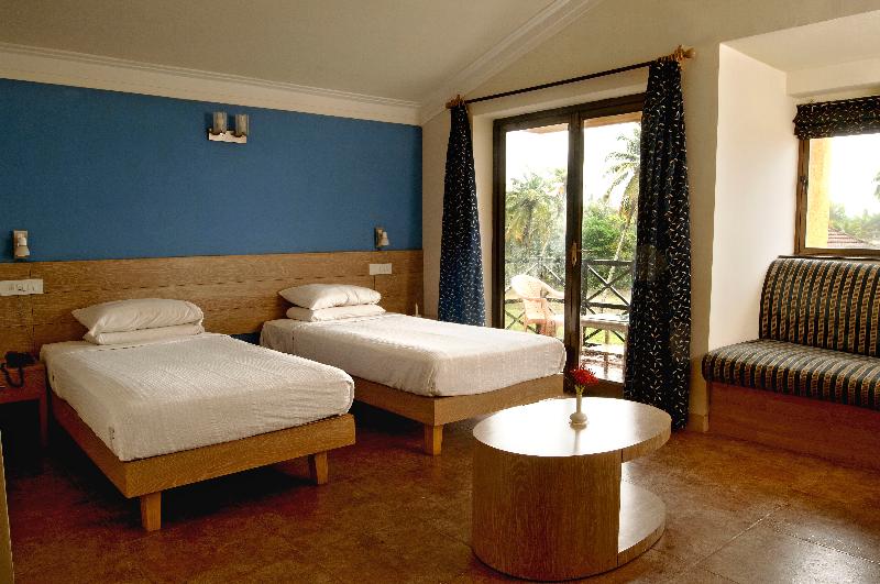 Photo of Whispering Palms Beach Resort, 4-star hotel in Candolim